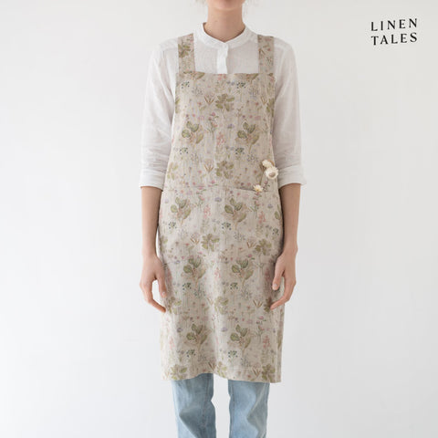 Linen apron, combining the durability quality of Lithuanian linen with stonewashed softness and appealing print and colour. A cross back pinafore design to slip on and off, with no ties. Shown in Botany print on Natural. Handmade from 100% linen (185g) in Lithuania by Linen Tales.