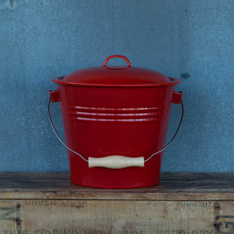 Falcon enamel five litre bucket with wooden grip handle. Perfect for collecting vegetable and fruit scraps for chickens, worm farms, or compost.
