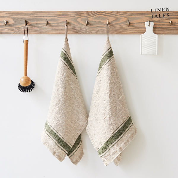 Linen tea towel, 40 x 65 cm, combining the drying and durability qualities of Lithuanian linen with stonewashed softness and appealing print and colour. Shown in Vintage Green Stripe on Natural. Handmade from 100% linen (310g) in Lithuania by Linen Tales.