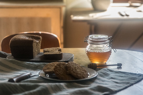 Decant your honey or maple syrup into a Kilner Honey Pot and Drizzler Spoon, or even better find a honey retailer or beekeeper who will bottle honey into your reusable jar.