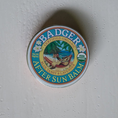 Indulge your sun-parched skin with Badger Balm After Sun Balm of moisturising plant butters infused with soothing Blue Tansy and Lavender.