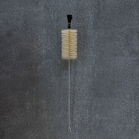 Bottle brush with black tip, designed for vigorous cleaning of hard to reach containers and bottles.