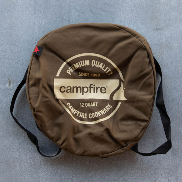 Camp Oven Canvas Bag with padded walls to protect cast iron cookware. Heavy duty cotton canvas bag has reinforced webbing carry straps, built in solid base, and strong reliable zipper.