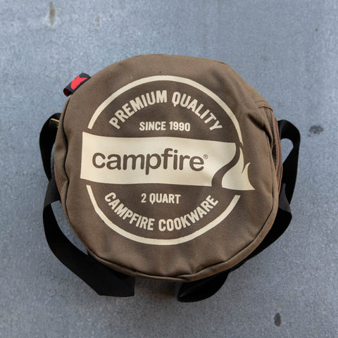 Camp Oven Canvas Bag with padded walls to protect cast iron cookware. Heavy duty cotton canvas bag has reinforced webbing carry straps, built in solid base, and strong reliable zipper.