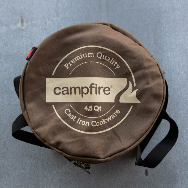 Camp Oven Canvas Bag with padded walls to protect cast iron cookware. Heavy duty cotton canvas bag has reinforced webbing carry straps, built in solid base, and strong reliable zipper.