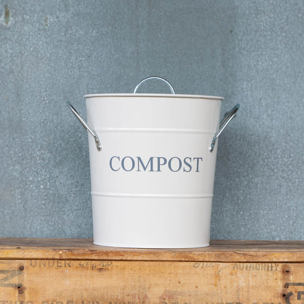 Compost Bin with lid and removable, washable bucket liner. Perfect for storing kitchen scraps for chickens or the compost pile. Chalk coloured exterior with the word 'Compost' in charcoal coloured printing.