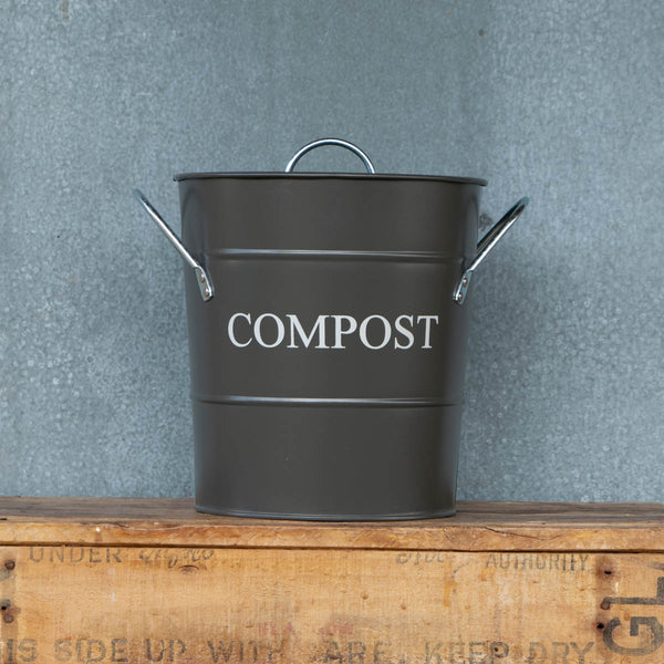 Compost Bin with lid and removable, washable bucket liner. Perfect for storing kitchen scraps for chickens or the compost pile. Charcoal exterior with the word 'Compost' in chalk coloured printing.