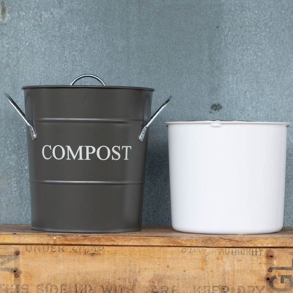 Compost Bin with lid and removable, washable bucket liner. Perfect for storing kitchen scraps for chickens or the compost pile. Charcoal exterior with the word 'Compost' in chalk coloured printing.