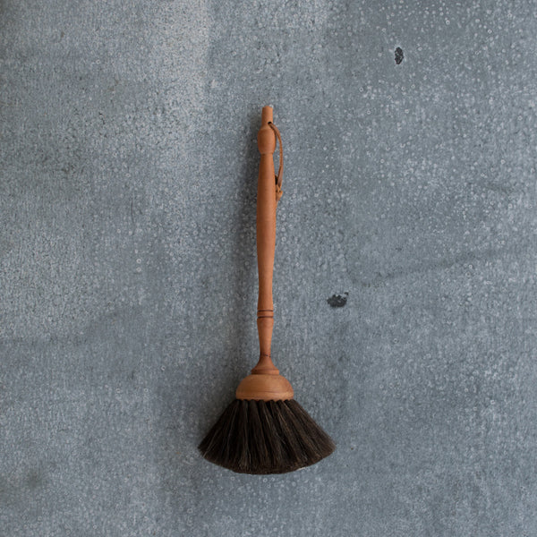 The Redecker goat hair duster catches everyone's eye in the shop. With a waxed pear wood turned timber handle and dust brush made from the softest black goat hair the duster elevates a banal task to an enjoyable one.