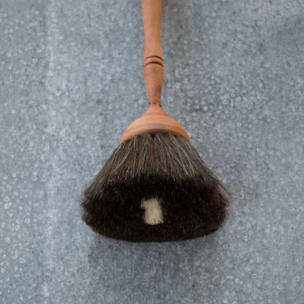 The Redecker goat hair duster catches everyone's eye in the shop. With a waxed pear wood turned timber handle and dust brush made from the softest black goat hair the duster elevates a banal task to an enjoyable one.