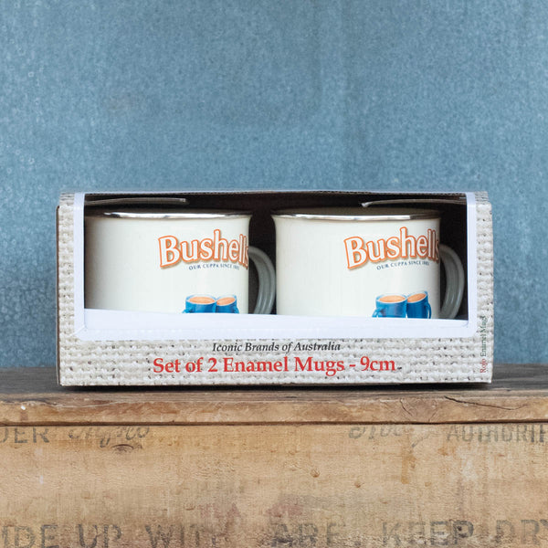 Enjoy the nostalgia and iconic vintage advertising brands of our enamel mugs, featuring the Bushell's logo, against a cream background.