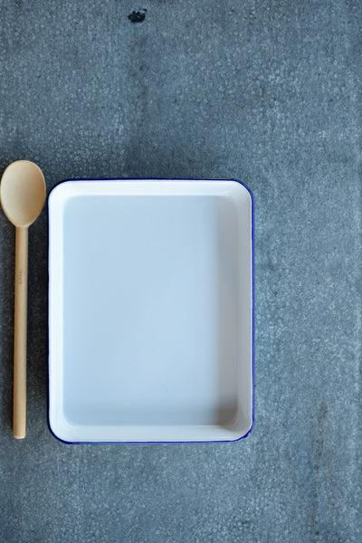 Falcon enamel baking tray, white with blue rim.