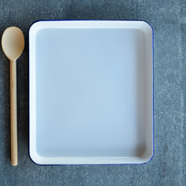 Falcon enamel baking tray, white with blue rim.