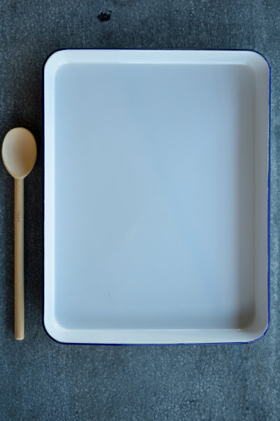 Falcon enamel baking tray, white with blue rim.