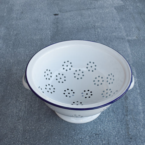 A perfect sized colander by Falcon enamelware for washing vegetables or draining pasta or rice. 