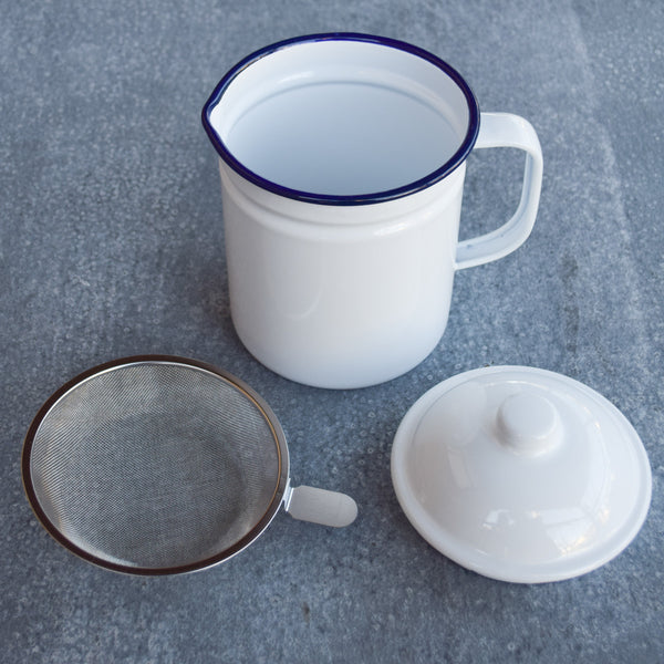 Falcon enamel dripping container, white with blue rim.