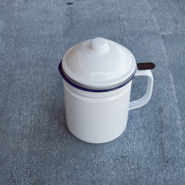Falcon enamel dripping container, white with blue rim. Pour cooking oil into the stainless steel strainer and when it solidifies in the container you have dripping.