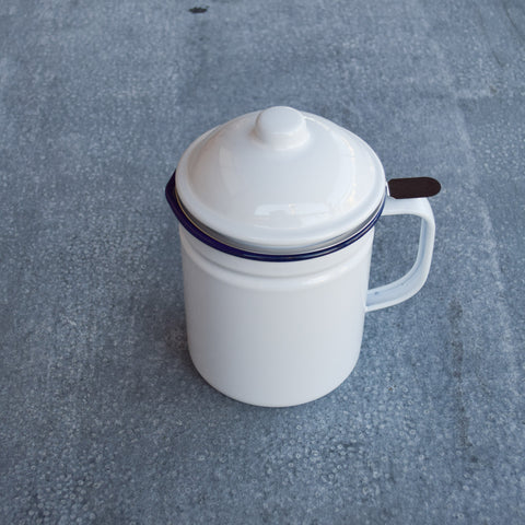 Falcon enamel dripping container, white with blue rim. Pour cooking oil into the stainless steel strainer and when it solidifies in the container you have dripping.