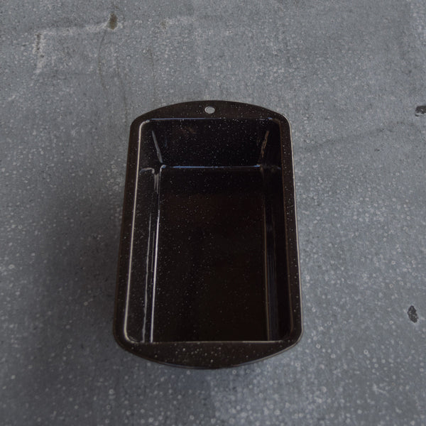 A Falcon enamel cake pan, rectangular in shape, ideal for loaf-style cakes (carrot cake, zucchini bread, banana bread).
