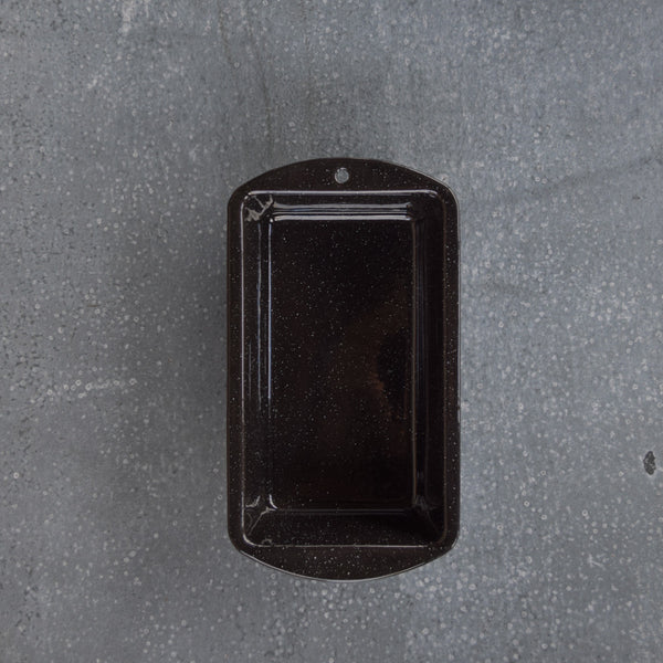 A Falcon enamel cake pan, rectangular in shape, ideal for loaf-style cakes (carrot cake, zucchini bread, banana bread).