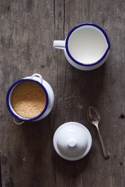 Falcon enamel milk jug and sugar bowl, white with blue rim.