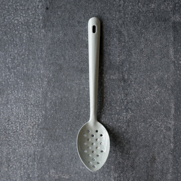 Falcon enamelware perforated spoon in duck egg and 30cm long. Perforated spoons are useful in the kitchen for draining liquids or retrieving foods from liquids.