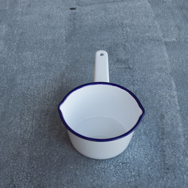 A Falcon enamel saucepan in ice white and cobalt blue. With lips on two sides the Falcon enamel saucepan is just what you need to brew chai, warm milk or heat a sauce on the stove.