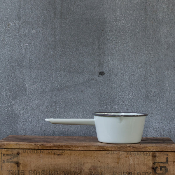 A Falcon enamel saucepan in duck egg with grey rim. With lips on two sides the Falcon enamel saucepan is just what you need to brew chai, warm milk or heat a sauce on the stove. 