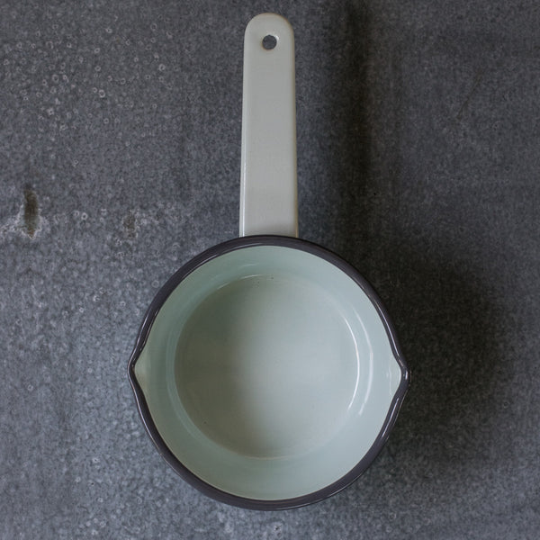 A Falcon enamel saucepan in duck egg with grey rim. With lips on two sides the Falcon enamel saucepan is just what you need to brew chai, warm milk or heat a sauce on the stove. 