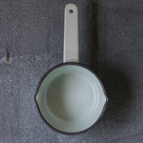 A Falcon enamel saucepan in duck egg with grey rim. With lips on two sides the Falcon enamel saucepan is just what you need to brew chai, warm milk or heat a sauce on the stove. 