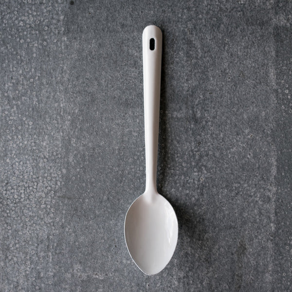 New in stock, a Falcon enamelware spoon in white, 30cm long. Use for stirring foods during cooking or serving food onto plates for sharing. 