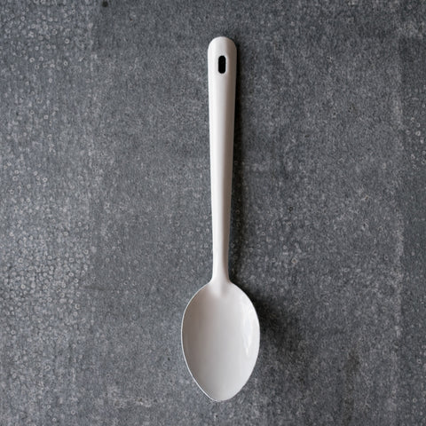 New in stock, a Falcon enamelware spoon in white, 30cm long. Use for stirring foods during cooking or serving food onto plates for sharing. 