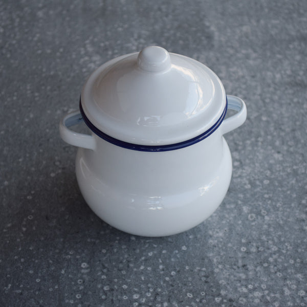 Complete the tea party with a Falcon enamelware sugar pot with lid (creamer also available). In Falcon's signature ice white with cobalt blue rim, it is the perfect complement to our Falcon enamel tea pot, kettle or coffee pot, and neutral enough to pair with your own collection.