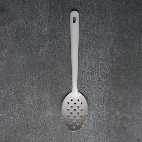 Falcon enamelware perforated spoon in white and 30cm long. Perforated spoons are useful in the kitchen for draining liquids or retrieving foods from liquids.