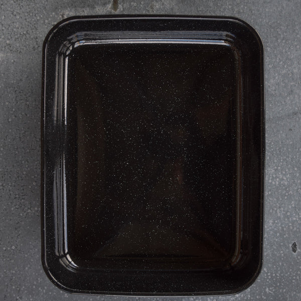 Reach for this deep Falcon enamel oblong roasting pan when cooking for a crowd. Dimensions: external rim to rim, 41 x 33cm, depth 8cm. Black graniteware, black with white speckles.