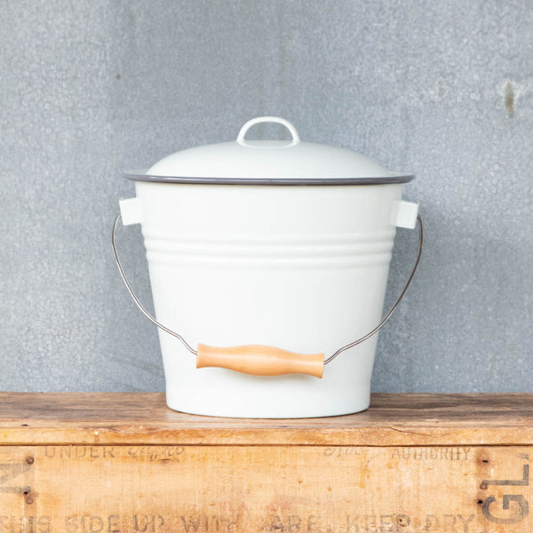 Falcon enamel five litre bucket with wooden grip handle. Perfect for collecting vegetable and fruit scraps for chickens, worm farms, or compost.