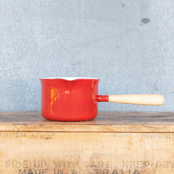 You'll find a multitude of uses for this Falcon enamel miniature saucepan from melting butter to warming milk and brewing chai. Available here in two-tone red exterior and white interior with a pouring lip and timber handle.