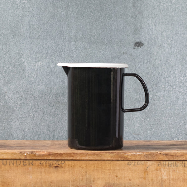 A must-have Falcon enamel measuring jug, one litre/4 cups, in black, white, duck egg or grey exterior and white interior with black printed measures. Extremely useful for measuring and pouring liquids when cooking.