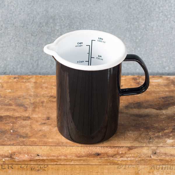 A must-have Falcon enamel measuring jug, one litre/4 cups, in black, white, duck egg or grey exterior and white interior with black printed measures. Extremely useful for measuring and pouring liquids when cooking.