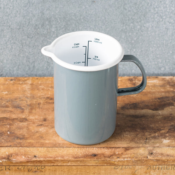 A must-have Falcon enamel measuring jug, one litre/4 cups, in black, white, duck egg or grey exterior and white interior with black printed measures. Extremely useful for measuring and pouring liquids when cooking.