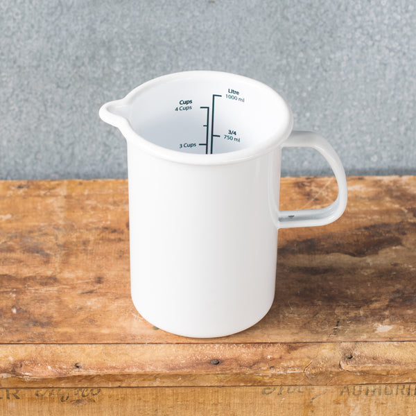 A must-have Falcon enamel measuring jug, one litre/4 cups, in black, white, duck egg or grey exterior and white interior with black printed measures. Extremely useful for measuring and pouring liquids when cooking.