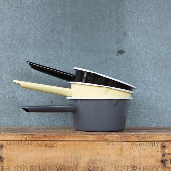 Use our Falcon enamel saucepan in two-tone black exterior and white interior to brew chai, warm milk, or heat a sauce on the stove. The saucepan has two lips for easy pouring, is 850ml, 8cm deep and 14cm diameter. 