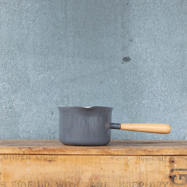 You'll find a multitude of uses for this Falcon enamel miniature saucepan from melting butter to warming milk and brewing chai. Available here in two-tone grey exterior and white interior with a pouring lip and timber handle.