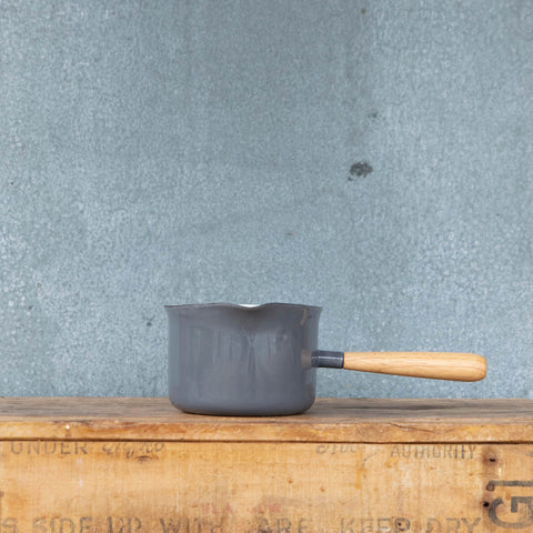 You'll find a multitude of uses for this Falcon enamel miniature saucepan from melting butter to warming milk and brewing chai. Available here in two-tone grey exterior and white interior with a pouring lip and timber handle.