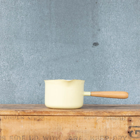 You'll find a multitude of uses for this Falcon enamel miniature saucepan from melting butter to warming milk and brewing chai. Available here in two-tone yellow exterior and white interior with a pouring lip and timber handle.