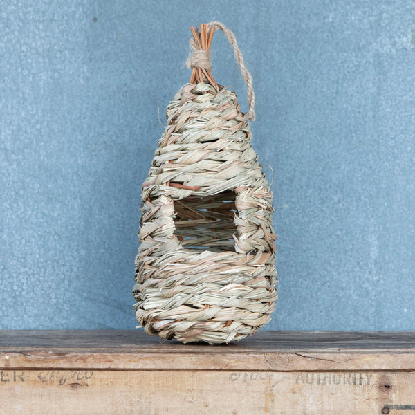 Hang nesting pockets in your garden to encourage and protect small birds, providing shelter from harsh weather.
