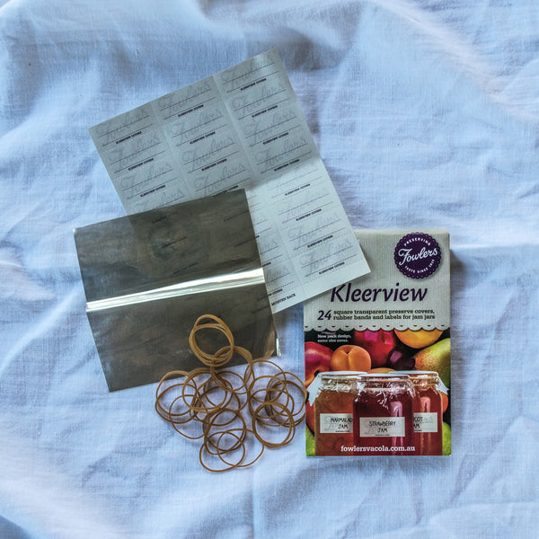 Use Fowlers Vacola Kleerview 24 square transparent preserve covers, rubber bands, and labels for jam jars to seal and identify preserves. 