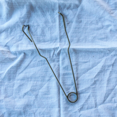 Use the Fowlers Vacola Preserving Bottle Tongs, specifically designed to remove hot bottles from your preserving unit after processing without dislodging lids from bottles.