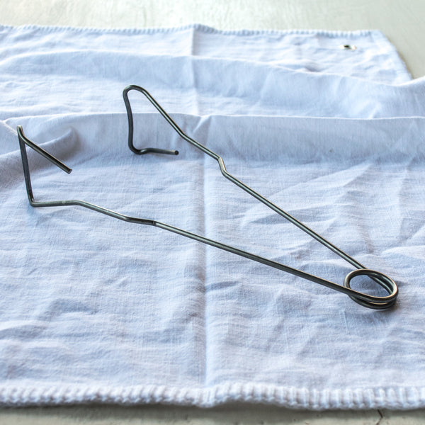 Use the Fowlers Vacola Preserving Bottle Tongs, specifically designed to remove hot bottles from your preserving unit after processing without dislodging lids from bottles.