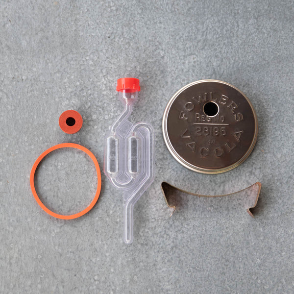 Fowlers Vacola Fermentation Lid Set to get started with fermenting. The set includes a Fowlers Vacola Lid to fit Fowlers Bottle No.31, No.36 or No.65, lid clip, two rubber seals and an air lock.